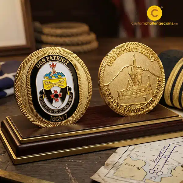 USS Patriot MCM-7 challenge coins displayed beside a naval chart